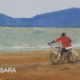 Poster of somebody riding a bike on the beach, promoting Gerardo Ramírez at Sendero Hotel in Nosara.